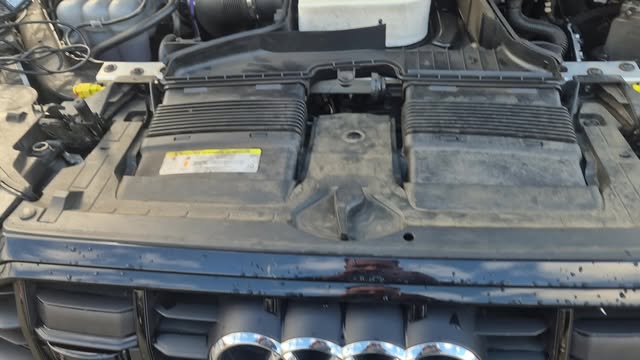 An engine bay with the front cowling removed, part way through a job.