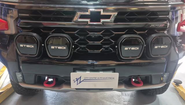 The grille of a Chevrolet fitted with four STEDI LED light pods.